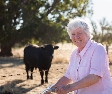 Photograph of farmer with Angus stud bull on Australian Farm