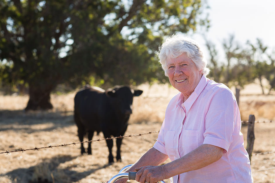 Photograph of farmer with Angus stud bull on Australian Farm